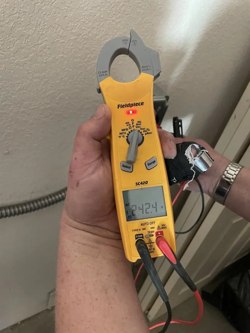 Voltage testing with clamp meter during Generator Installation in Tallmadge